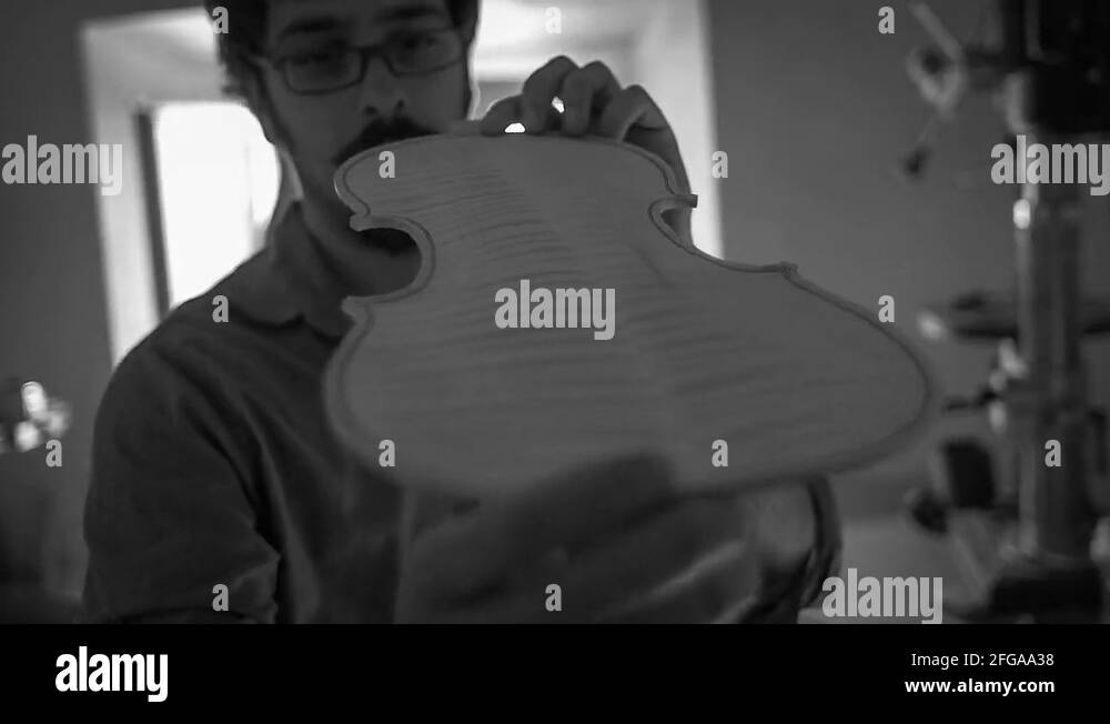 Luthier making a violin Stock Video Footage Alamy