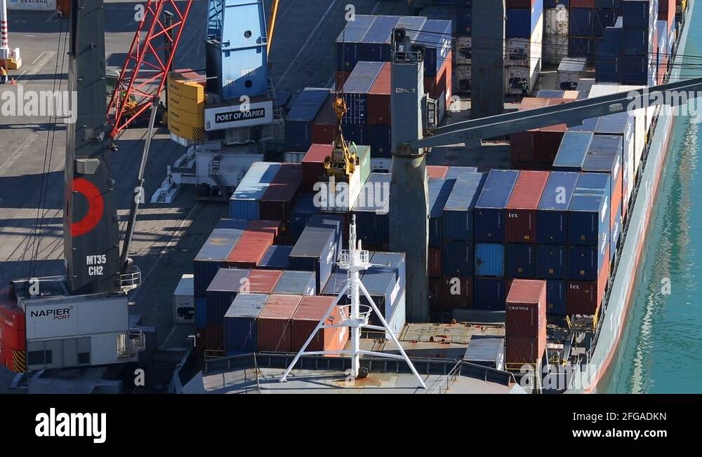 Crane unloading containers off ship Stock Video Footage Alamy