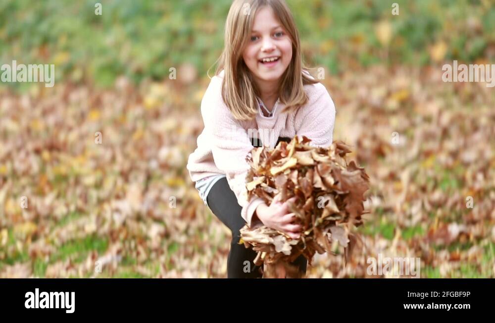 Girl throwing leaves Stock Videos & Footage HD and 4K Video Clips Alamy