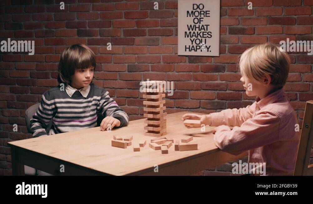 Children playing Jenga Stock Video Footage - Alamy