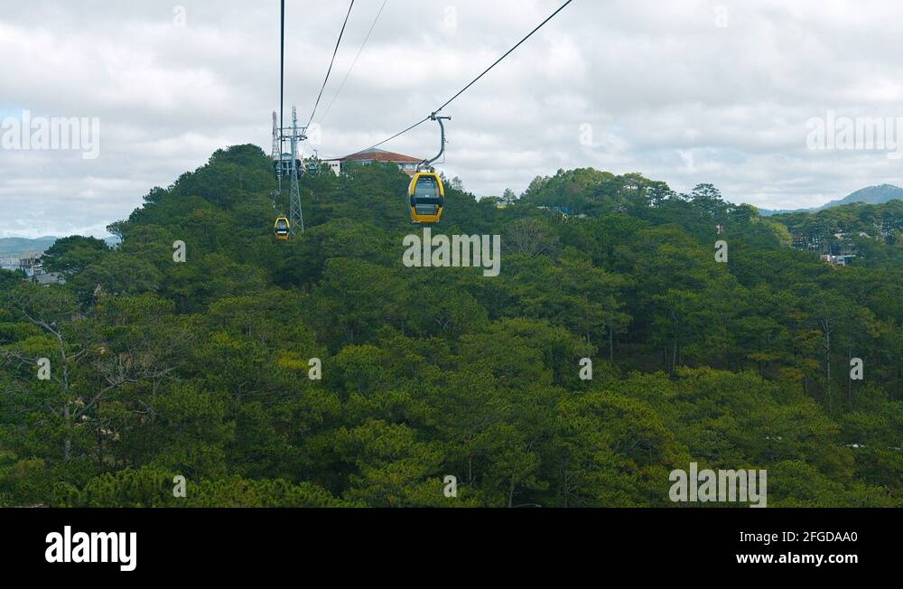 Suspended Cable Car Gondolas Glide over Trees in Vietnam. Video FullHD