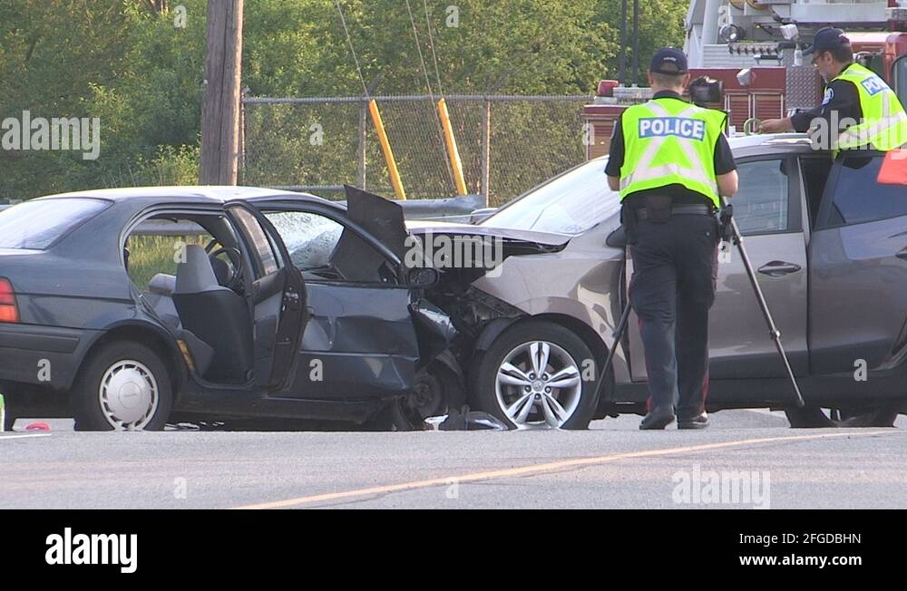 Deadly fatal head on car crash in city of Toronto intersection Stock