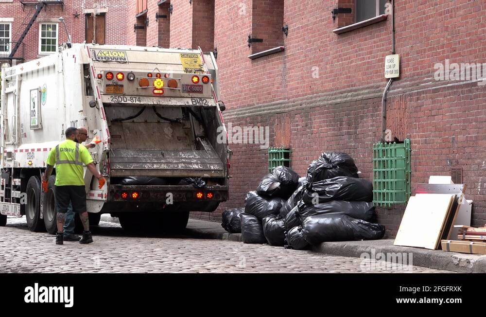 Garbage truck compacting trash bags in New York City 4k Stock Video Footage Alamy