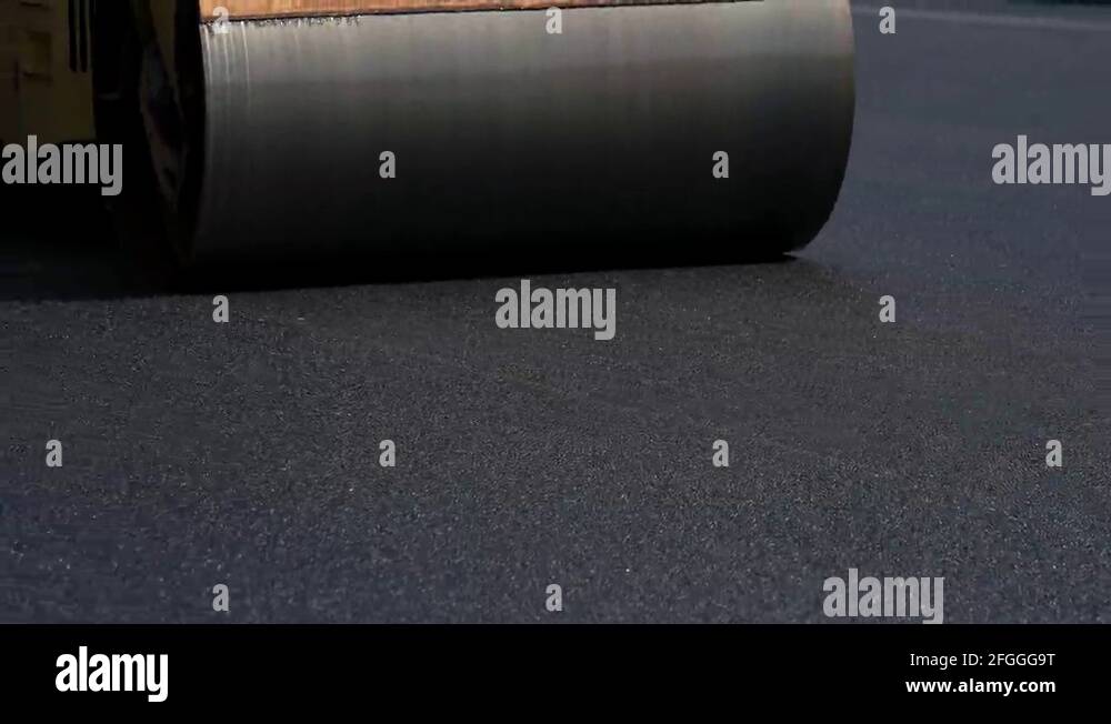 Steel wheel of asphalt compactor Stock Video Footage Alamy