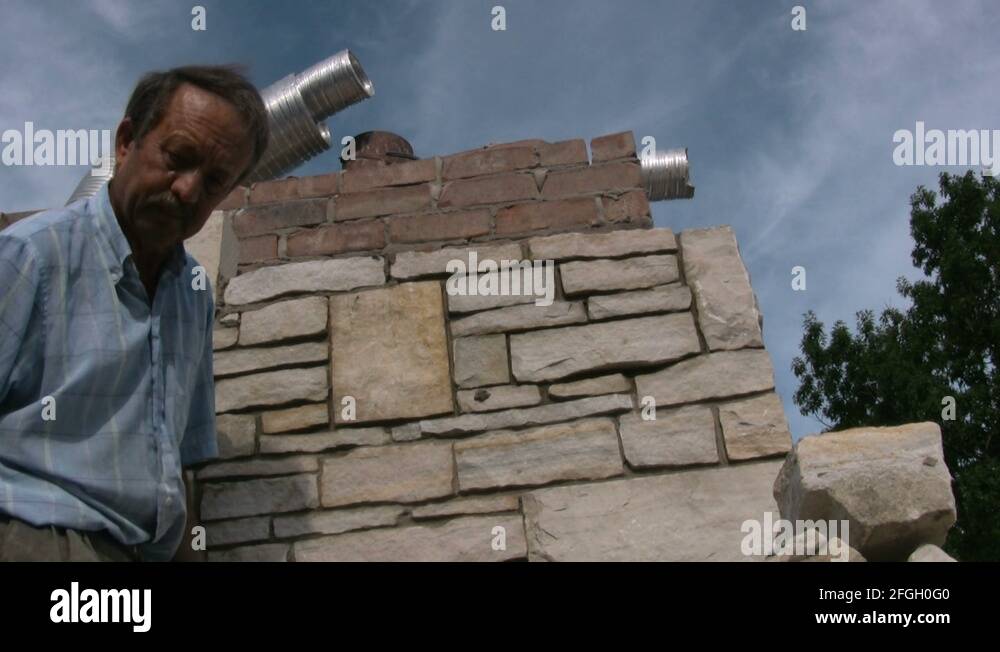 Brick Mason laying stone Stock Video Footage Alamy