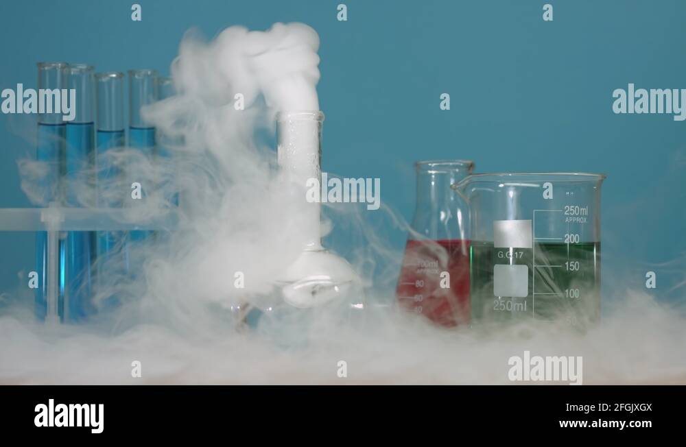 Put piece of dry ice in flask with hot water Stock Video Footage Alamy