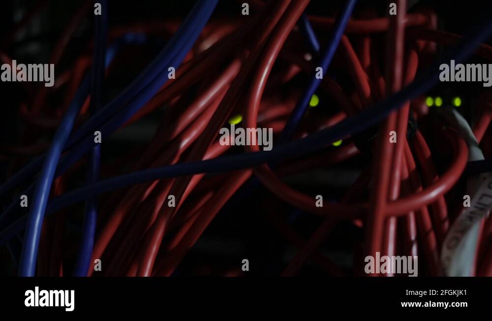 Close up of wires in Server Room with flashing lights Stock