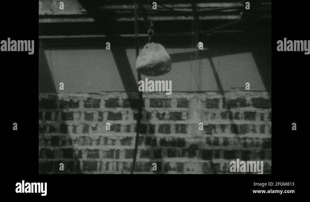 1950s Wrecking ball swinging / Wrecking ball hits building / Wall falls Stock Video Footage Alamy