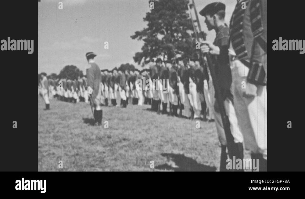 1950s Revolutionary War reenactors. British soldiers stand in line and