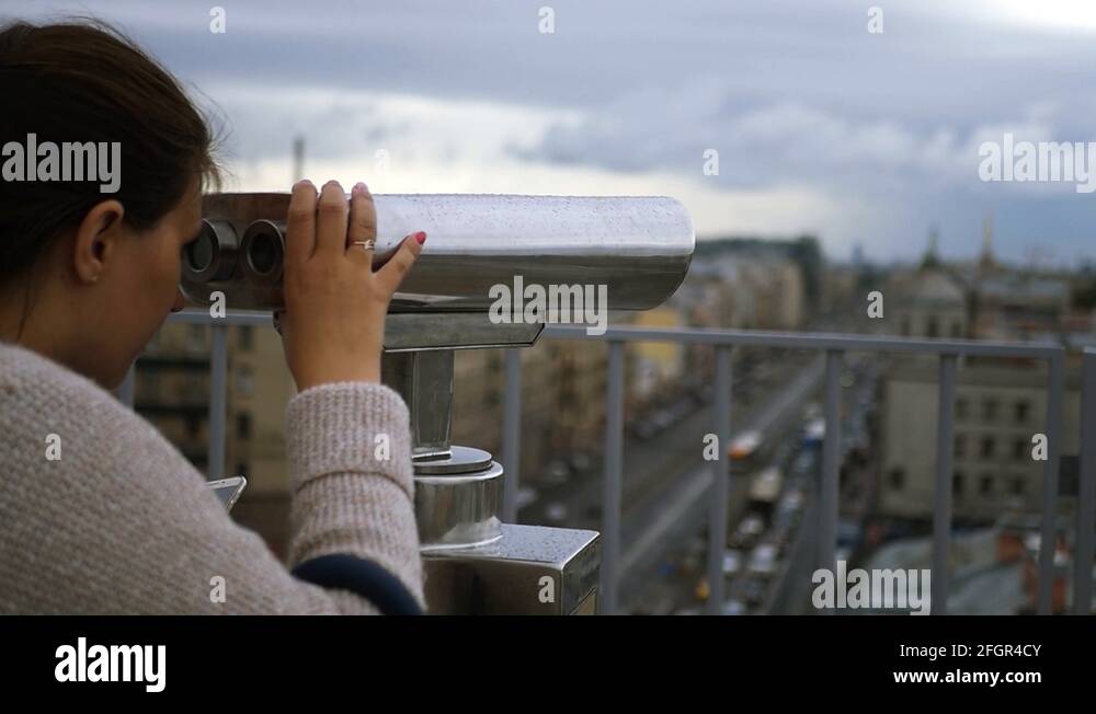 Admire the city in the viewing telescope. slow motion, 1920x1080, full