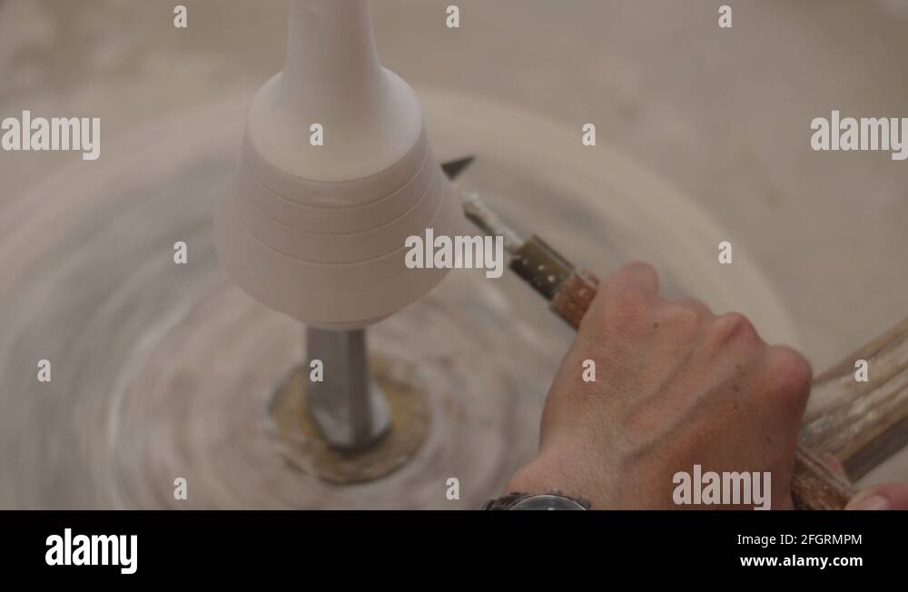 man modeling plaster cast pottery with ceramic tools Stock Video