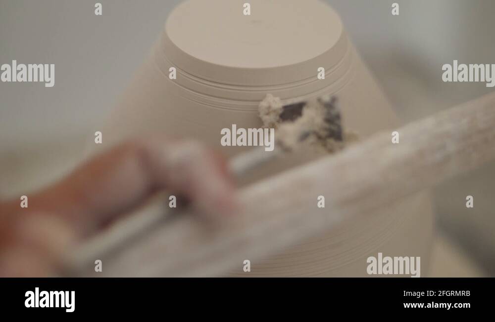 man modeling plaster cast pottery with ceramic tools Stock Video