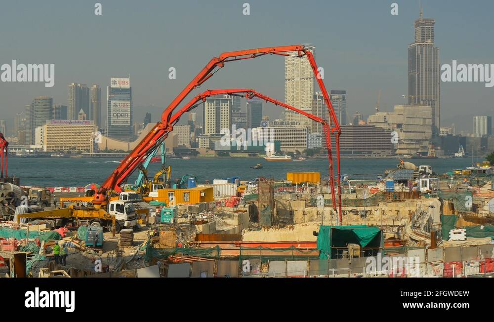 day time hong kong city construction concrete crane bay panorama 4k