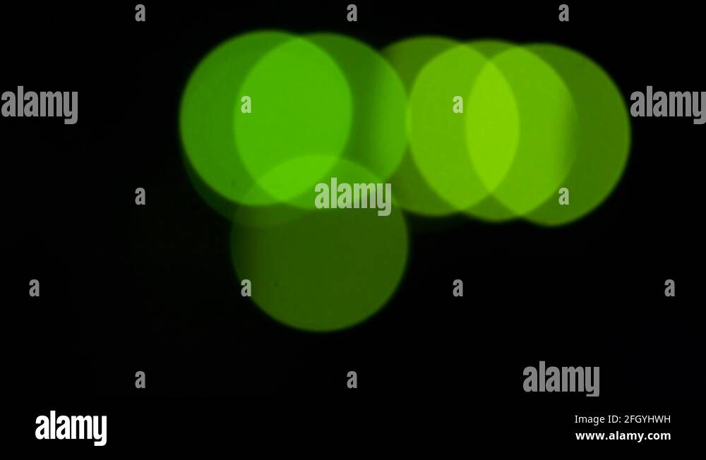 Green bokeh LED lights blinking on back side of working switch in