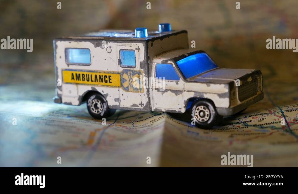 Toy Ambulance with blinking blue lights on a country map Stock Video