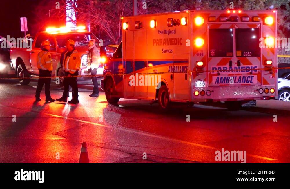 Emergency medical ambulance with flashing lights on at incident scene Stock Video Footage Alamy