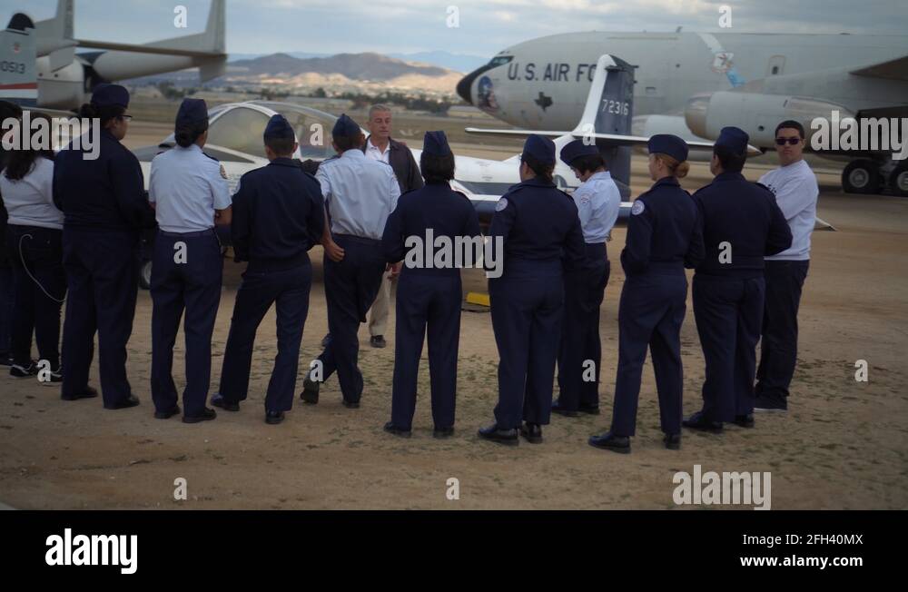 Civil air patrol cadets teenagers learning about airplanes at march