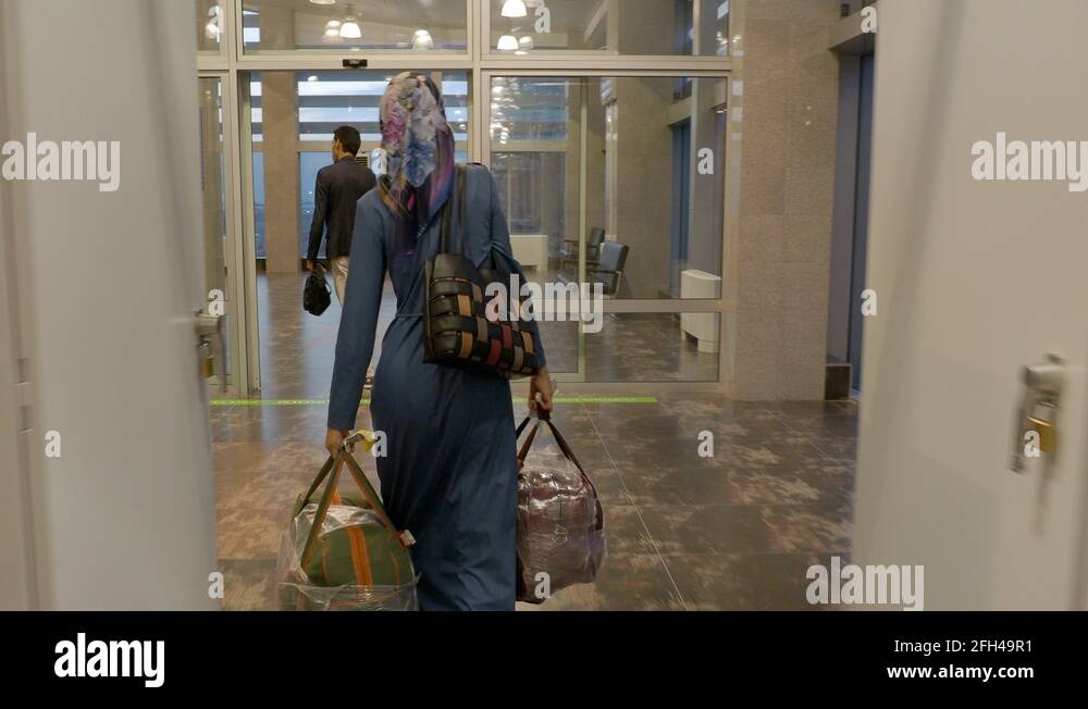 Muslim woman airport Stock Videos & Footage - HD and 4K Video Clips - Alamy