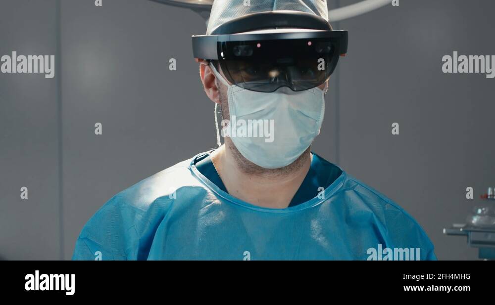 Portrait of surgeon using augmented reality hololens headset during ...