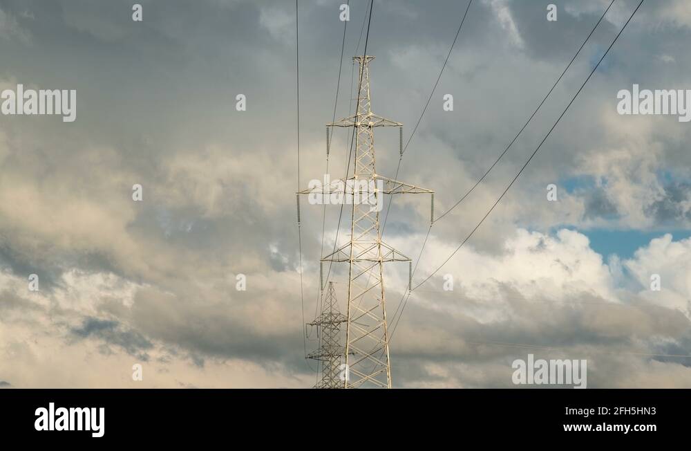 High voltage electricity tower pylons and transmission power lines on ...