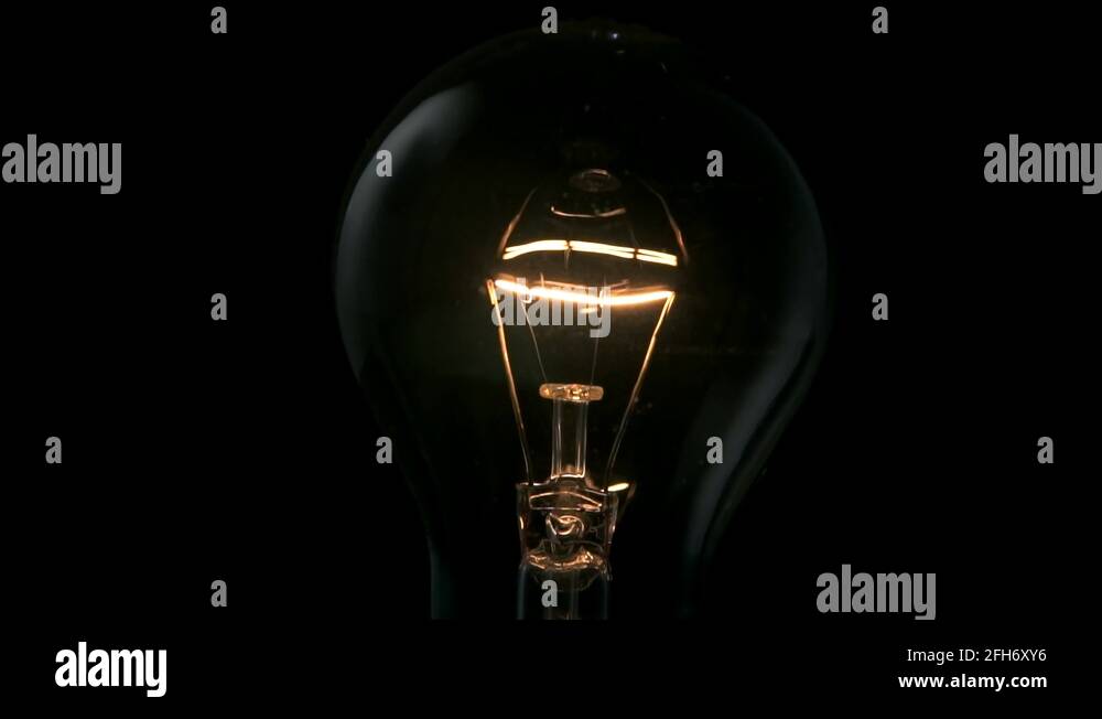 Light bulb flickering in slow motion. 4k Black background Stock Video Footage Alamy