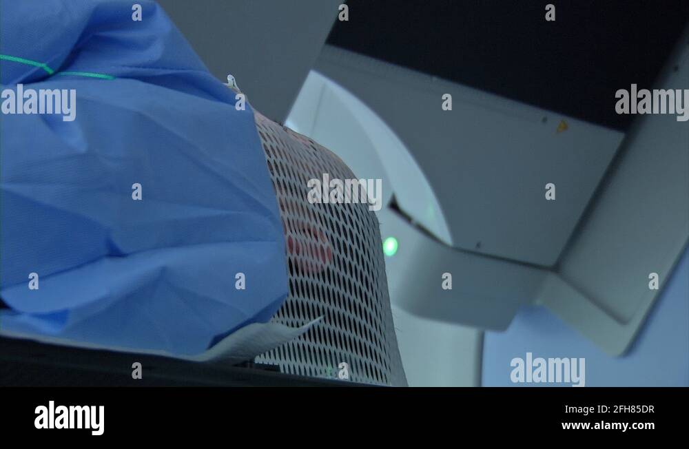Low Angle Side View Close Up Of A Male Patient Going Through Radiation Therapy Stock Video