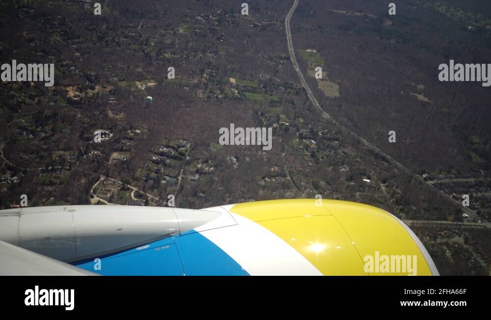 Earth from the airplane window. View of land and city from the airplane ...