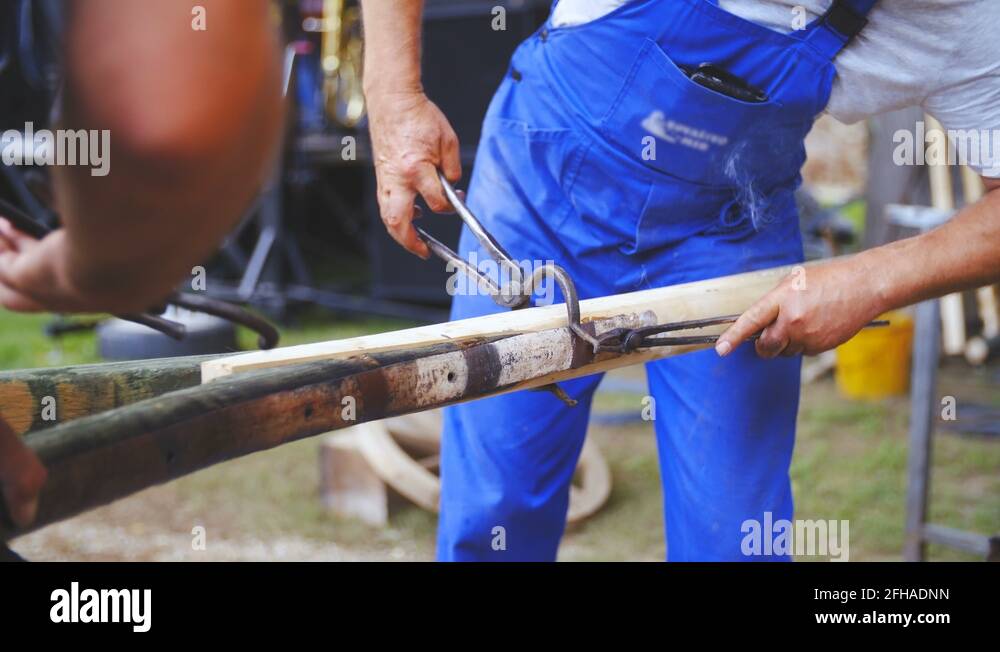 Blacksmith protects carriage splinter bar with hot iron layer 4K Stock Video Footage Alamy