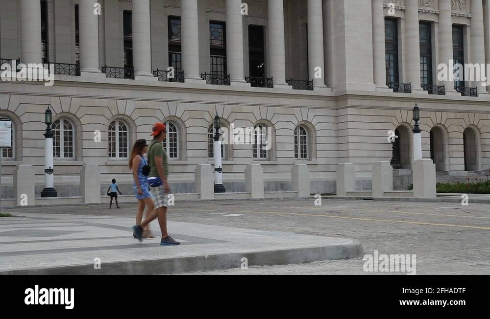 Young cuban boys playing baseball outside The Capital building in ...