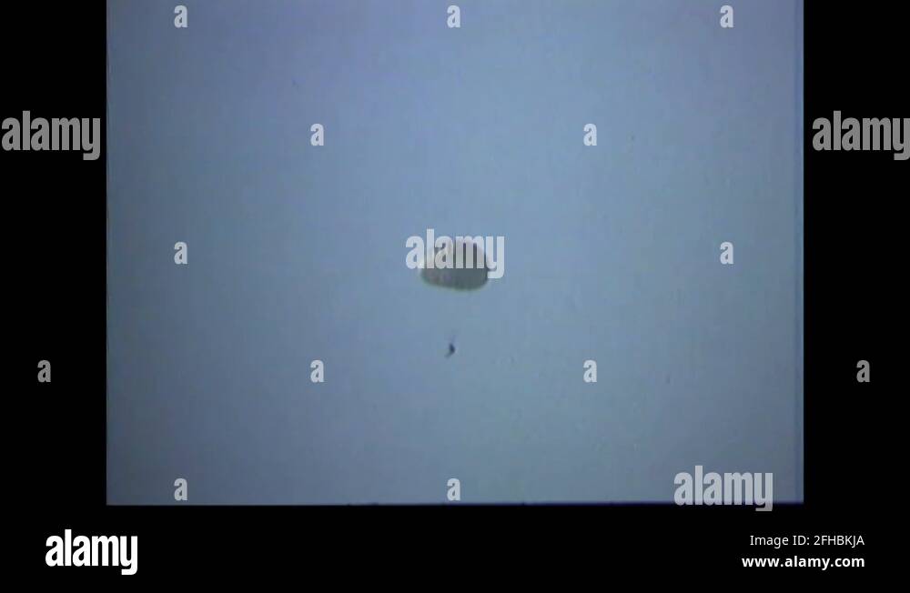 CIDG soldiers parachutes float down during airborne training 1969