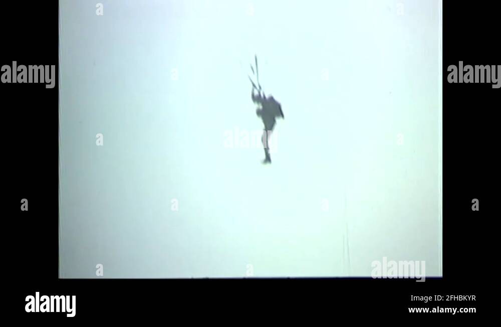 CIDG soldiers parachutes float down during airborne training 1969