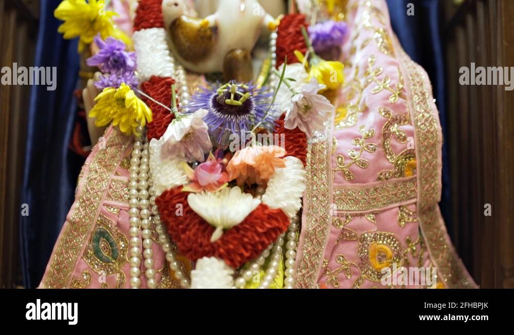 Moving extreme close up shot of a statue depicting the Hindu God