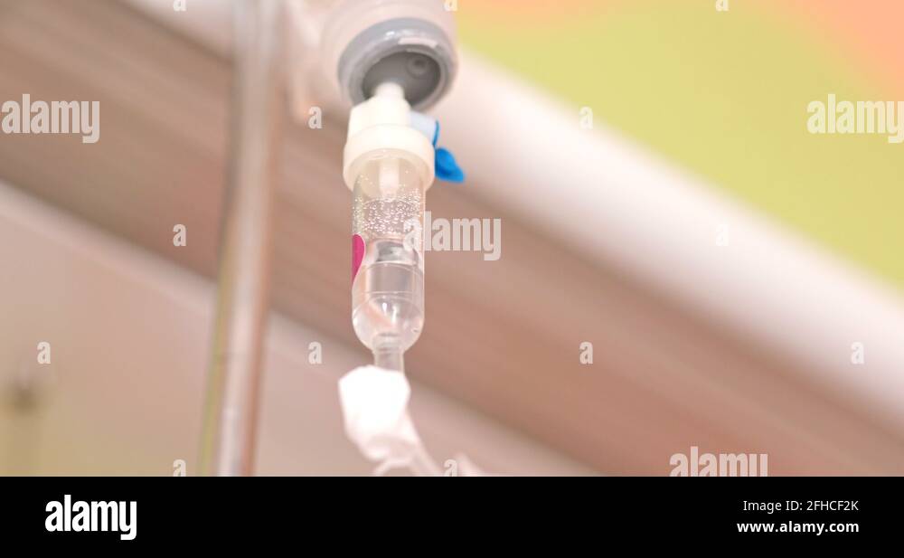 Dripping of iv saline solution in hospital Stock Video Footage Alamy