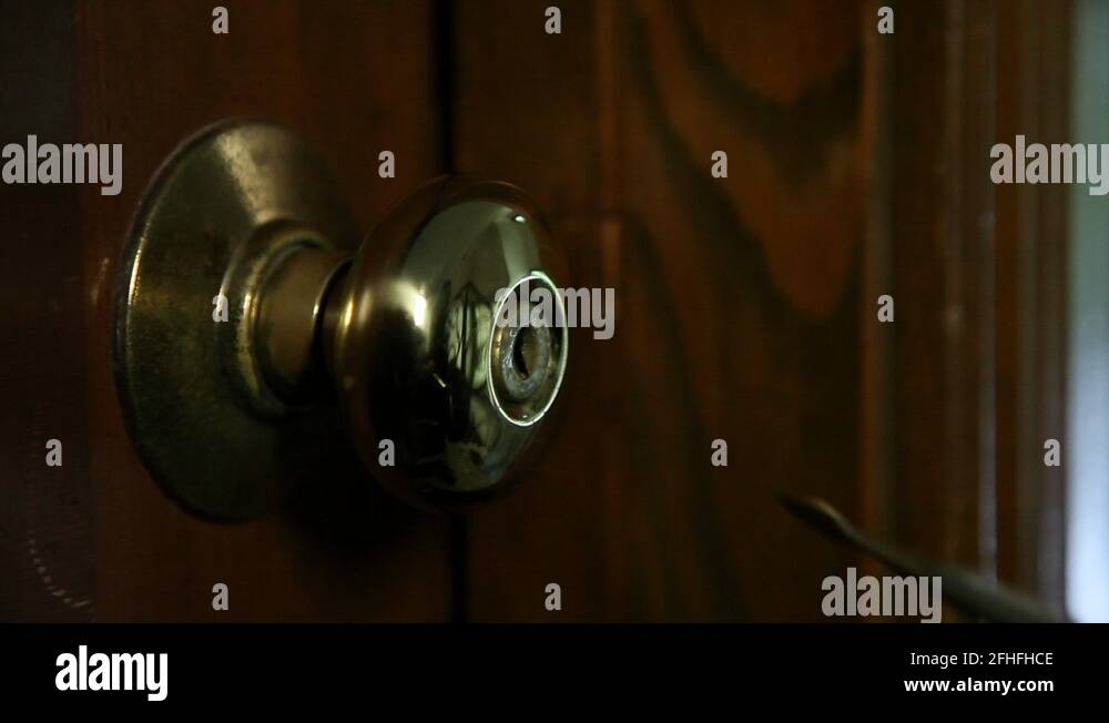 Door lock getting picked and opened by gloved hands Stock Video Footage