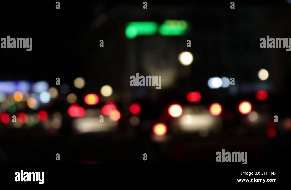 Defocused night traffic lights, bokeh effects of vehicle Stock Video