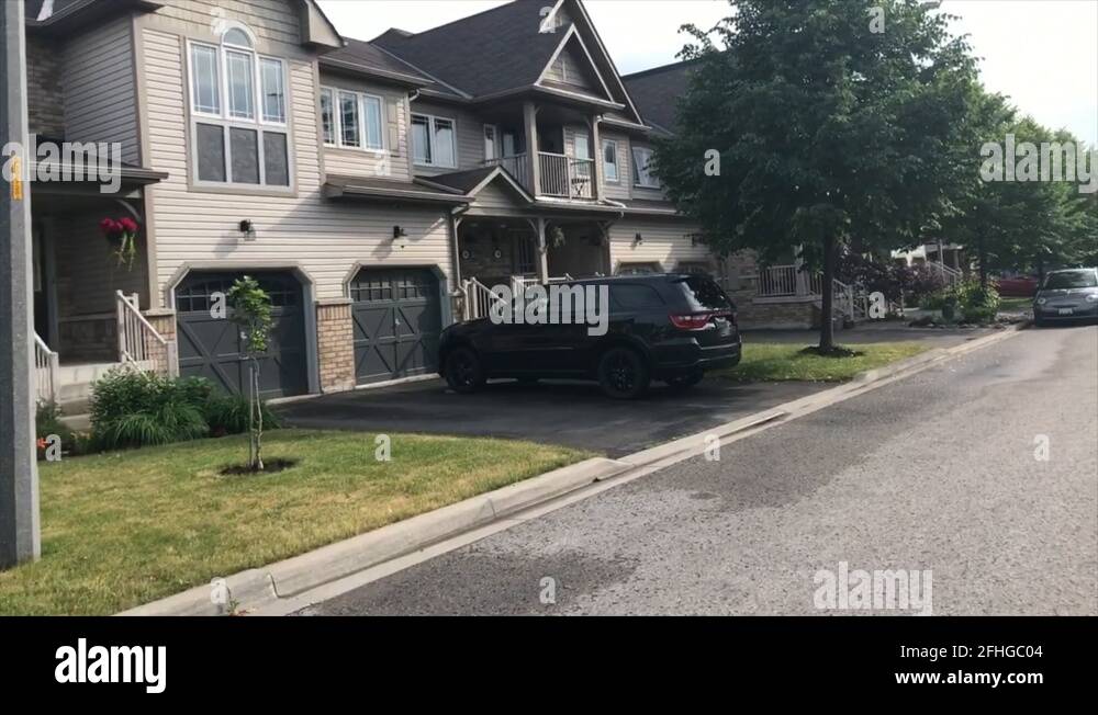 Driving through suburbs passing townhomes. Filmed on Gimbal from my van window Stock Video