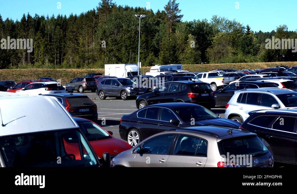 Cars parked at parking lot in norway, panning video airport Stock Video Footage Alamy