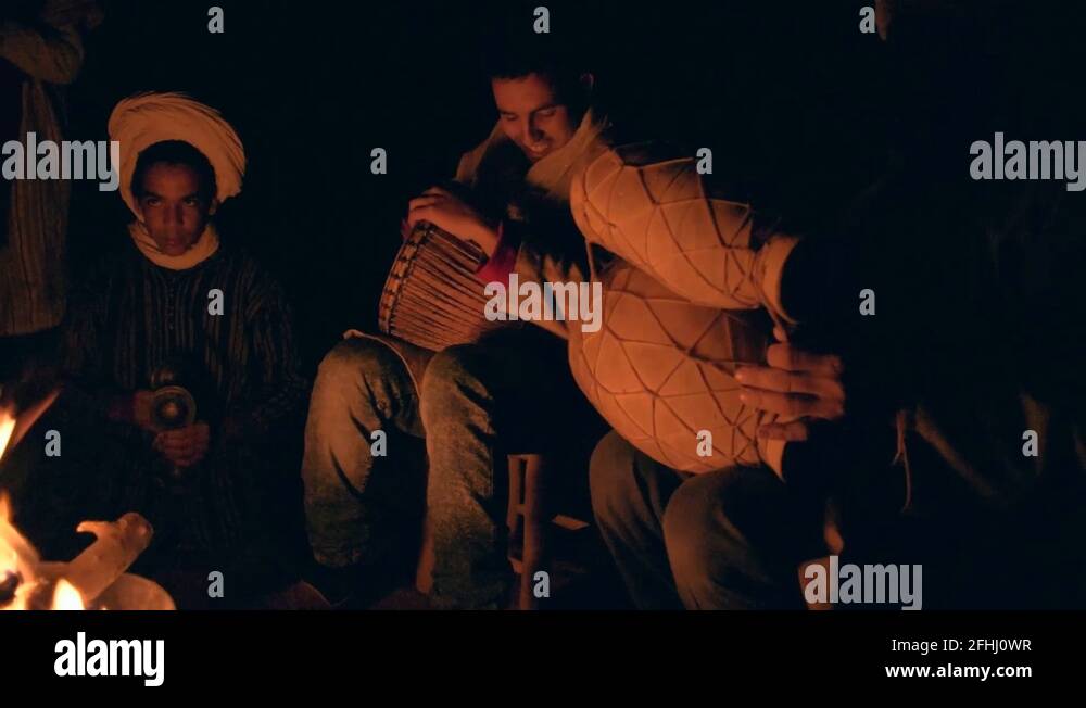 Moroccan berbers performing on their native music instruments around