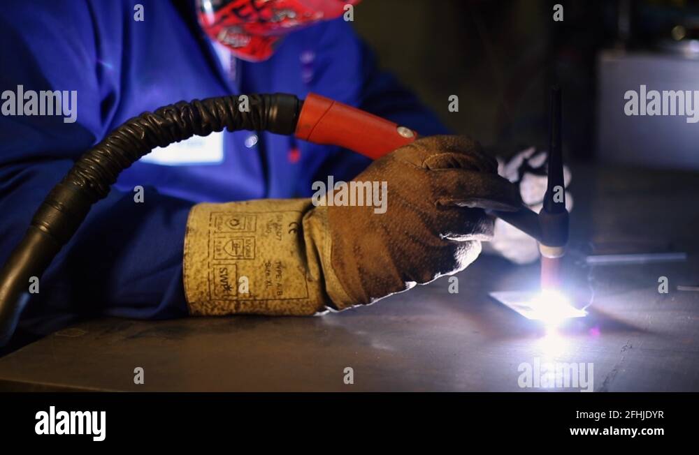 Joining two pieces of metal using the TIG WELDING technique Stock Video ...