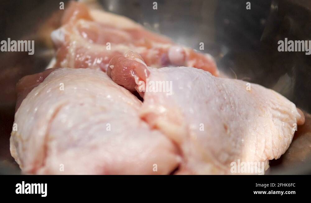 Pouring sauce for marinating with chicken wing, slow motion Stock Video