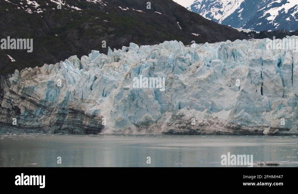 Margerie Glacier calving. Huge pieces of ice fall from the face of the