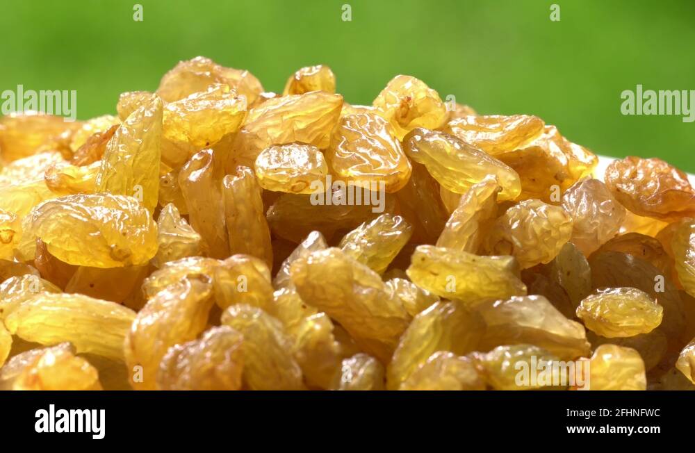 Light raisin largely. Healthy food. Dried fruits. Movement in a circle ...