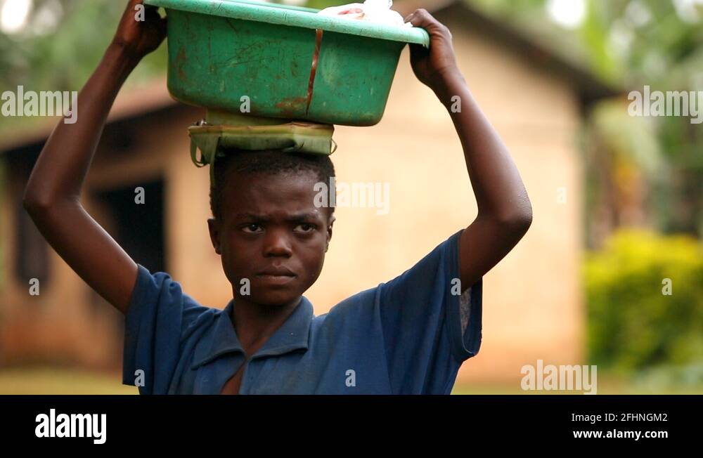 African kid bucket on head Stock Videos & Footage HD and 4K Video