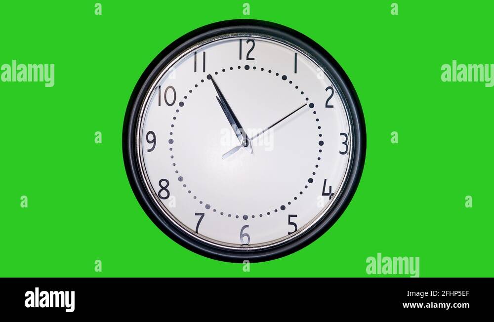 Hyperlapse of a simple modern wall clock in front of a green screen
