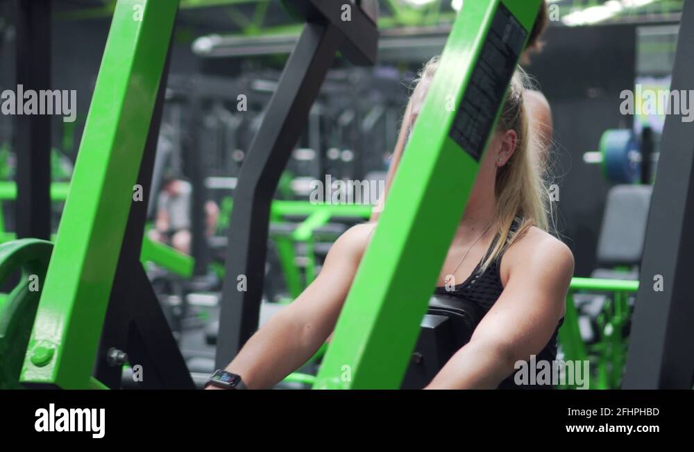 Cinematic Woman In Gym, Back Workout, Lateral Row Machine, 4K Strength