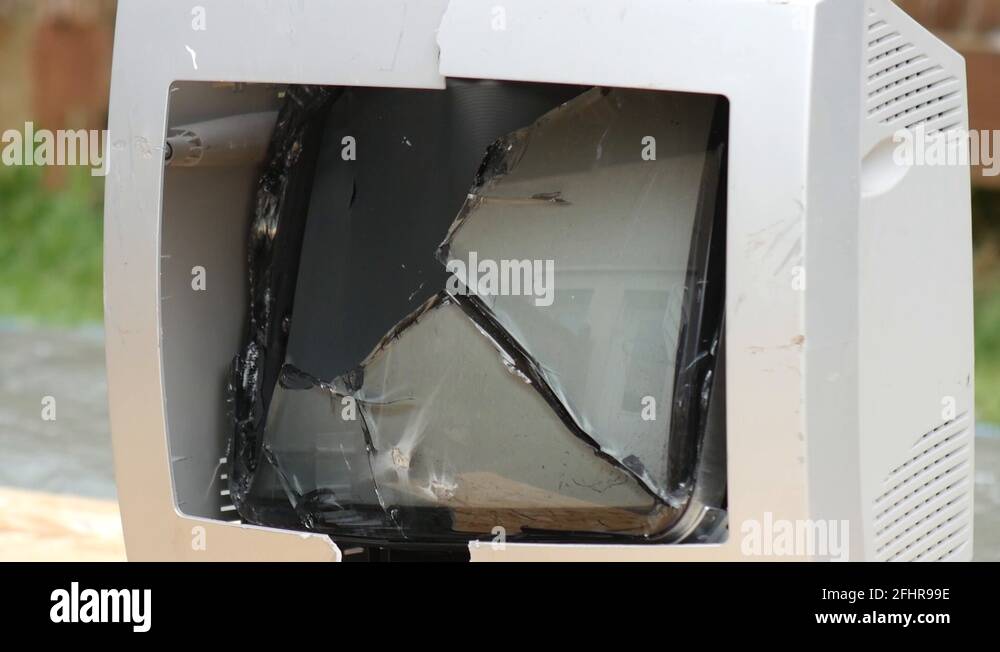 Retro white CRT computer monitor screen being destroyed by a thrown ...