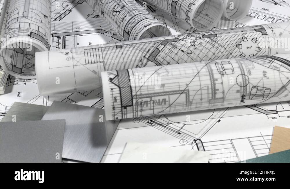 Blueprints rolls of architectural drawings, yardstick folding ruler