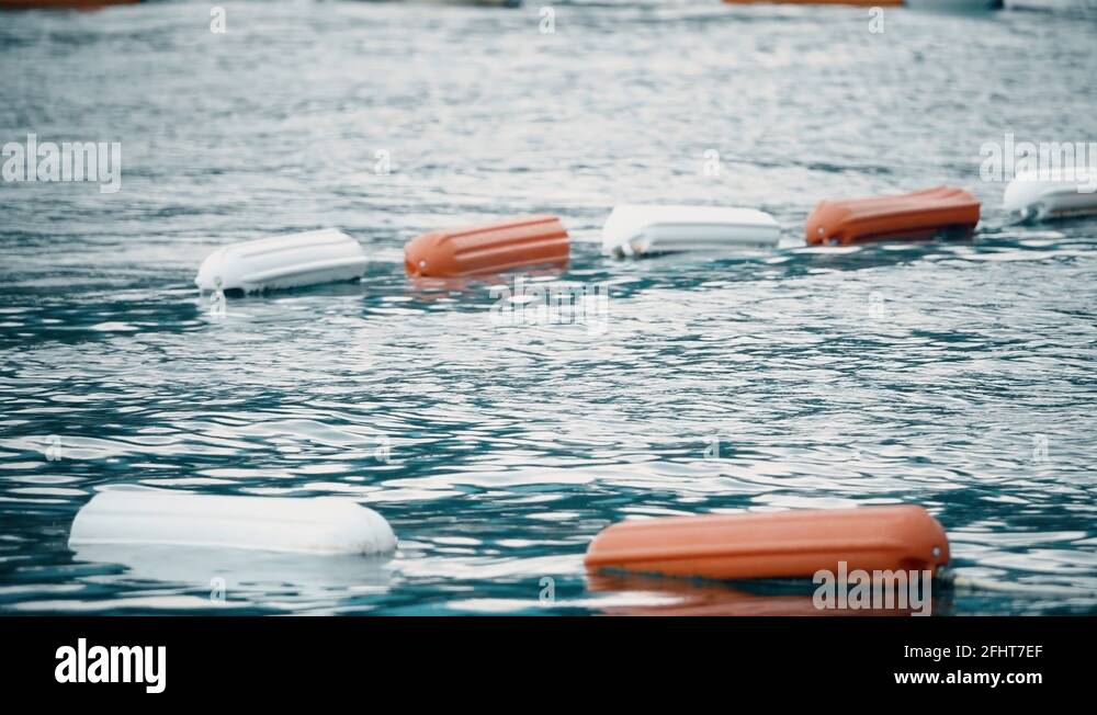 Border of swimming area at sea marked with floating buoys Stock Video ...