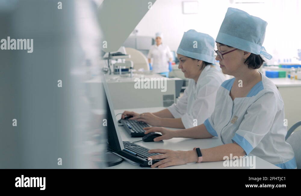 Female laboratory specialists working with pharmaceutical manufacturing