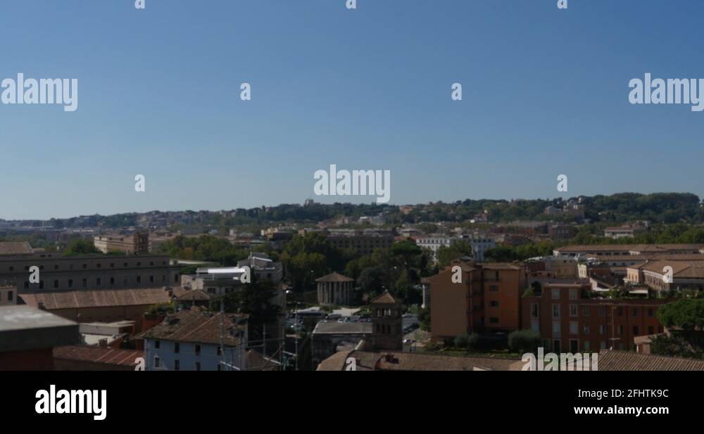 Pan view of the Italian rooftops, in capital city, Rome, filmed from ...